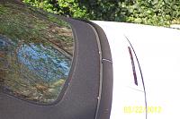 This is the way the rear bottom of the convertible top should be situated against the body. It should be even without any gap between the very bottom of the top and the body.