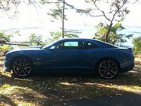 Modern muscle car with Penn Cove Mussel beds in background