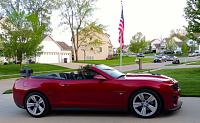 Car in front of flag  on driveway