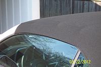 The infamous "wave" in the convertible top usually seen above the driver and / or passenger door.