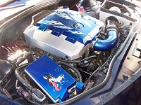 by the end of summer 2011 my engine compartment looks like this. I've done all the paint/decal work myself, added the CAI and catch can.
