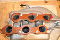 insulators bolted down while gasket maker dries