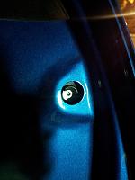 torx screw for door handle release.