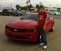My Camaro and I at the dealership when I bought it