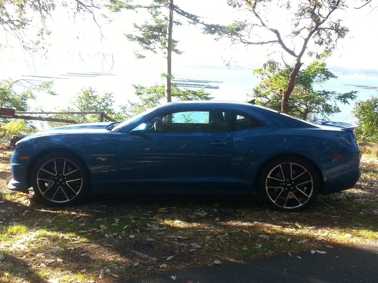 Modern muscle car with Penn Cove Mussel beds in background