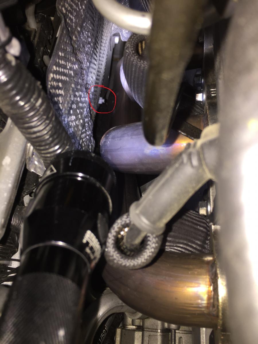 Header Fitment Issue on Passenger Side. Screw circled in Red can rub against header pipe. It will scratch header and at worst it can puncture the header pipe!  Cut about .75 inch off!