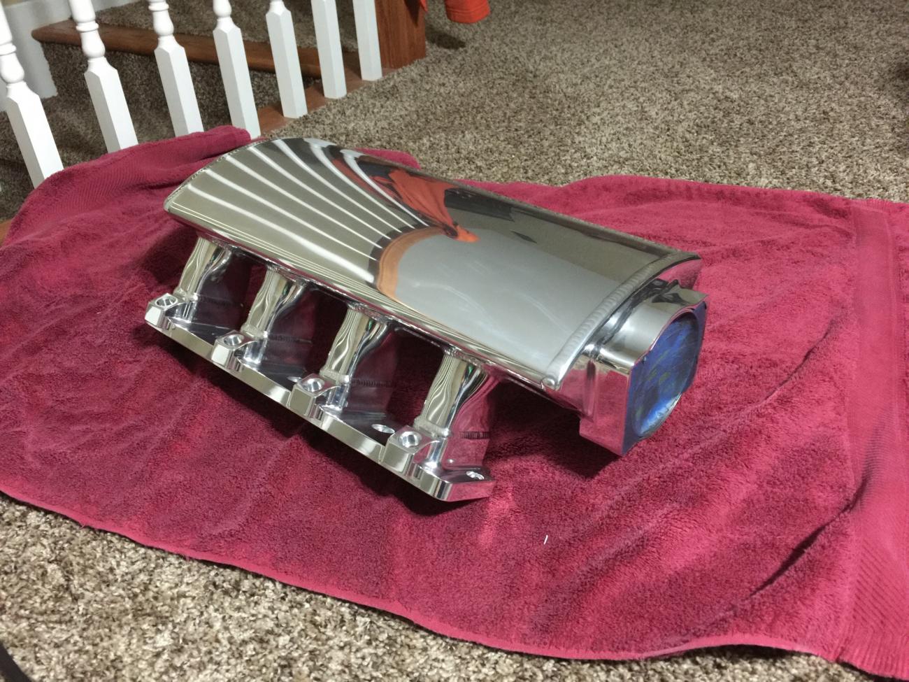 Hand sanded and polished sheet metal intake manifold.