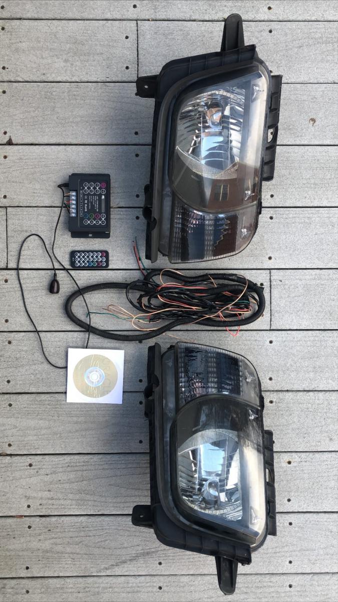 OEM Halogen Headlight Assembly and Oracle ColorShift 2.0 LED Halo Kit installed with infrared remote control and components #22959917/#22959918 (no wires or harnesses included)