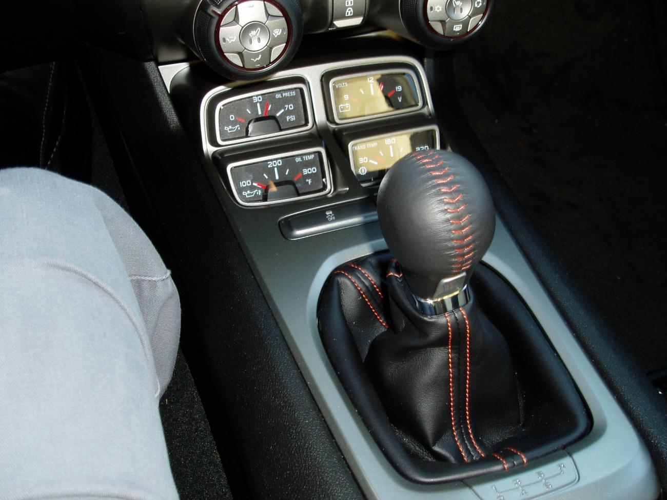 Camaro SSRS 6 speed shifter with the orange stitcing rest of the car is tan "is this a factory mistake ?? " I called the dealer and they are not sure why it is this color.  Any others out there with the same issue??